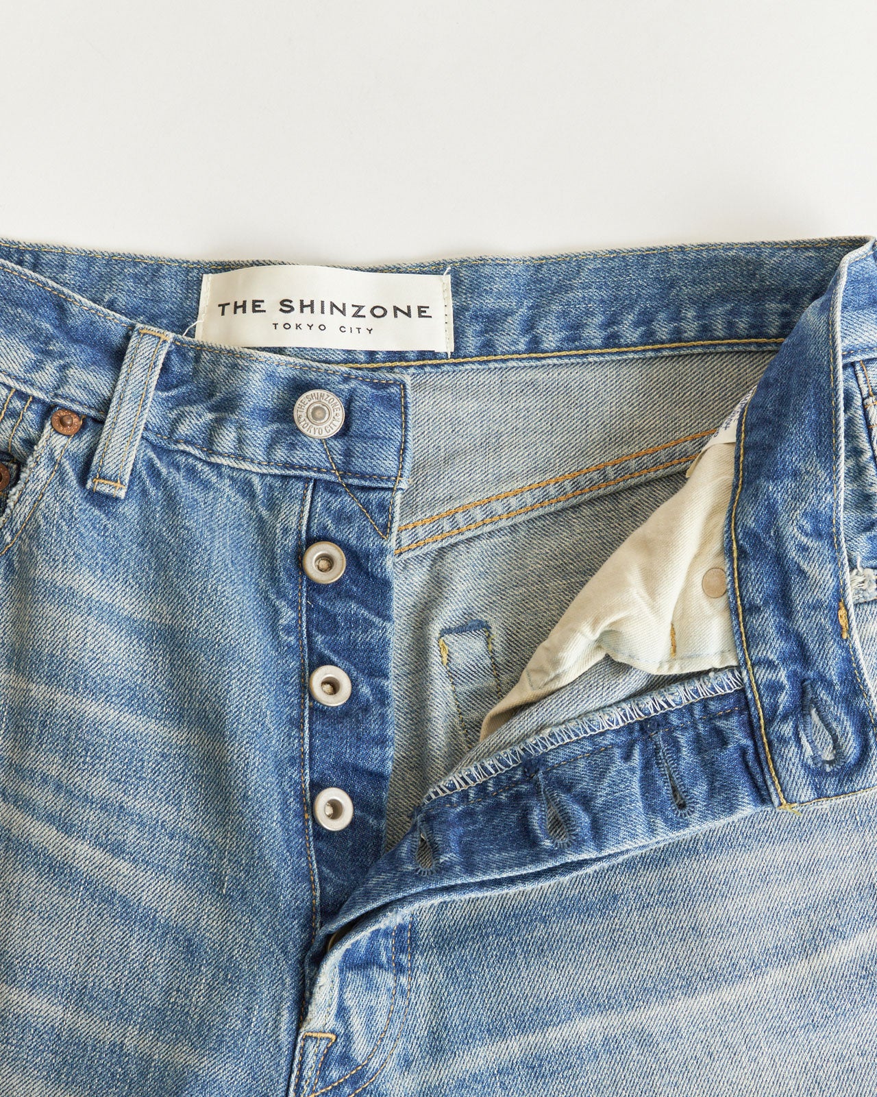 DAMAGE CLIP JEANS